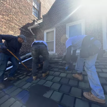 Professionals_applying_coat_on_the_roof_at_the_site_of_The_Premium_Roofing_in_114_Lexington_ave_Brooklyn_New_York_10016-8978