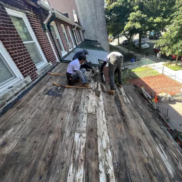 the_labour_team_was_seen_expertly_installing_shingles_on_the_roof_of_the_house_at_the_site_of_The_Premium_Roofing_in_114_Lexington_ave_Brooklyn_New_York_10016-8978