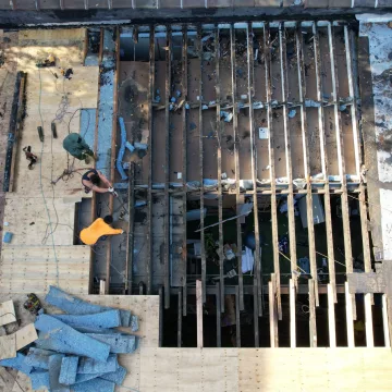 Ariel_view_of_the_roofing_site_by_The_Premium_Roofing_in_Brooklyn_New_York_where_the_labour_team_was_seen_expertly_installing_shingles_on_the_roof_of_the_house