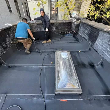 The_labour_team_was_seen_expertly_installing_shingles_on_the_roof_of_the_house_at_the_site_of_The_Premium_Roofing_in_Brooklyn_New_York